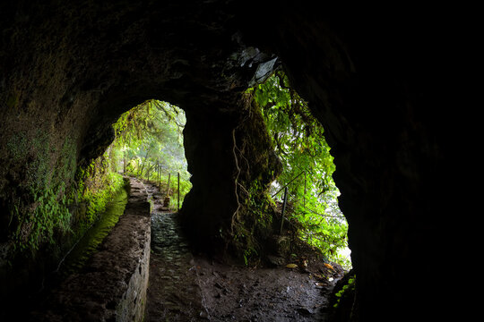 Small tunnel with two openings on Levada do Caldeirao Verde trail in Maderia