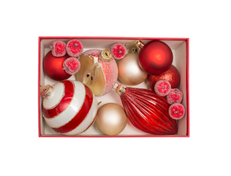 A festive assortment of red and beige Christmas ornaments arranged in a red box
