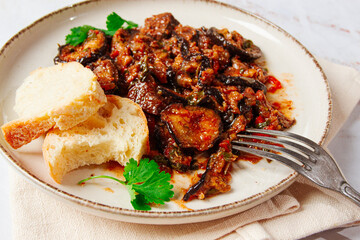 stewed meat with eggplant is a Georgian dish, on a light background,homemade, no people