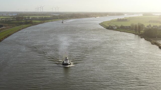Aerial Drone Video of the Tug Boat EN AVANT 9 Sailing in the Harbor or Sea.