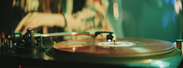 Experience the vibrant atmosphere of a nightclub with a DJ spinning records late at night in the city © Videophilia