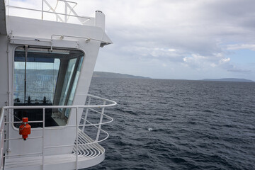 Calm Sea View From A Boat Deck Over A Tranquil Coastal Landscape