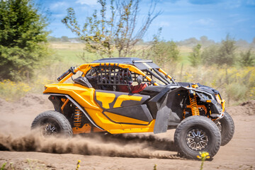 UTV buggy moves on dusty road. 4x4, extreme, adrenalin. © Antonio
