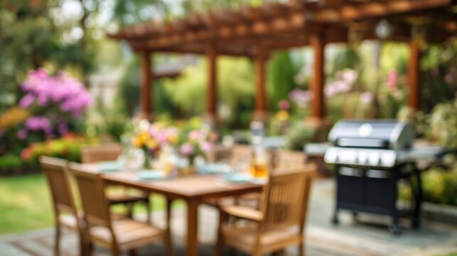 Blurred background of an outdoor patio dining area with a gas grill and pergola