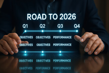 Road to 2026 business strategy plan with quarterly objectives and performance goals displayed in futuristic digital interface held by person in dark suit