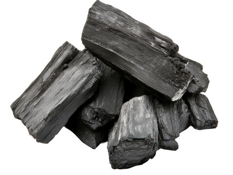 Pile of black charcoal pieces isolated