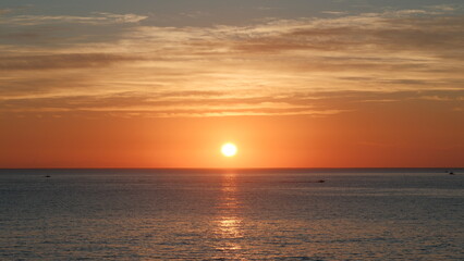 SUNRISE IN THE SEA PACIFIC OCEAN 