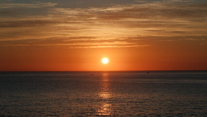 SUNRISE IN THE SEA PACIFIC OCEAN 