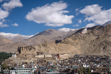 Leh, India - September 12, 2024: View of the city with Leh Palace and with snow capped mountains in the background