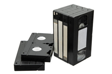 Obraz premium Stack of black VHS tapes and two lying flat, isolated on a white back
