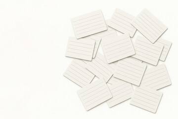 A pile of blank cards with lines on a light background. Space for text.