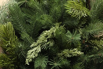 Branches of artificial Christmas tree as background, closeup
