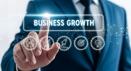 Businessman touching virtual screen with business growth text and icons, symbolizing development