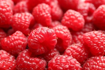 Fresh ripe raspberries as background, closeup view