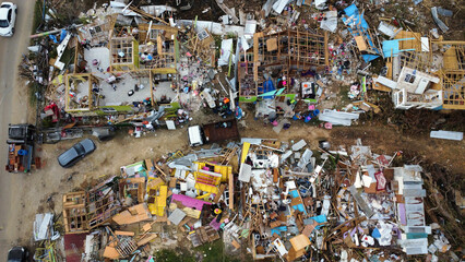 Aerial view of a densely populated urban slum with makeshift housing and cluttered streets