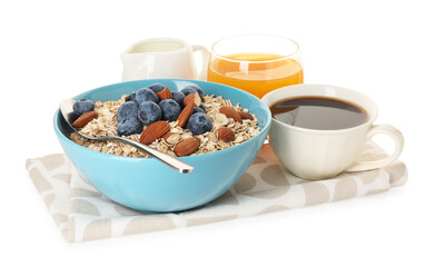 Tasty breakfast. Oat flakes with almonds, berries, coffee and orange juice isolated on white