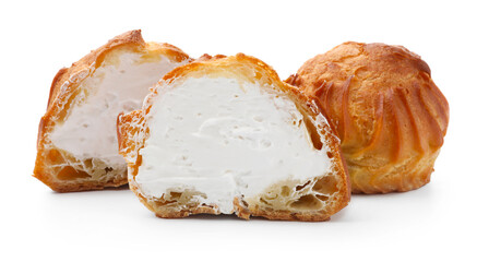 Tasty profiteroles with whipped cream isolated on white