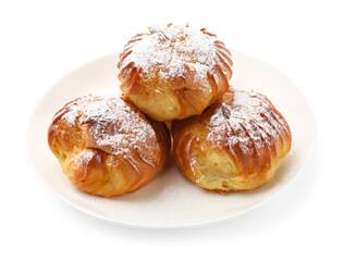 Tasty profiteroles with powdered sugar isolated on white