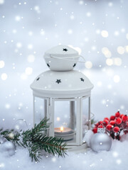 Christmas lantern in the snow in the forest. Beautiful greeting card