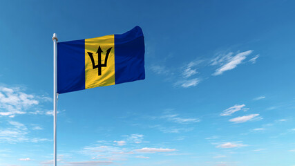 Barbados flag waving in the clear blue sky during a sunny day