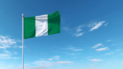 Waving Nigerian flag against a clear blue sky during a bright sunny day