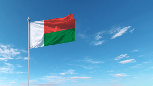 Flag of Madagascar waving against a clear blue sky on Independence Day celebrating the nation's sovereignty