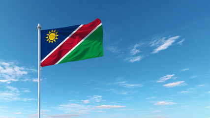 Celebration of Independence Day with the Namibian flag waving in a clear blue sky