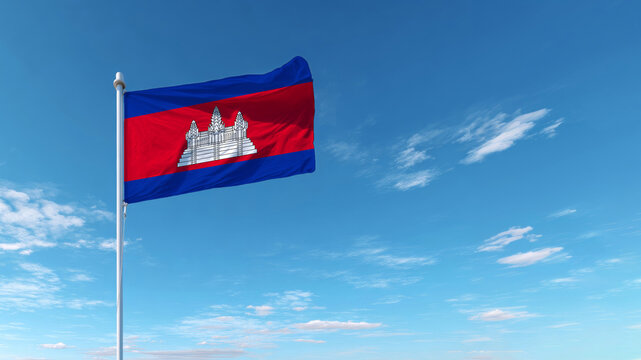 Cambodian flag flying proudly against a clear blue sky, symbolizing independence and national sovereignty - Powered by Adobe