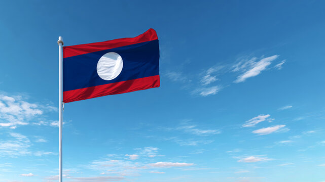 Lao flag waving proudly against a clear blue sky on a sunny day, symbolizing independence and sovereignty