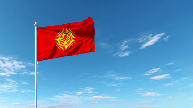 Kyrgyzstan flag waving proudly against a bright blue sky on an inspiring day of independence and sovereignty - Powered by Adobe