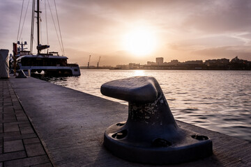 Beautiful sunset sky in the marina bay of Malaga city. Amazing colorful seascape.
