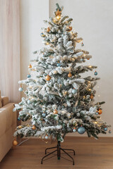 Decorated Christmas Tree into Cozy Living Room