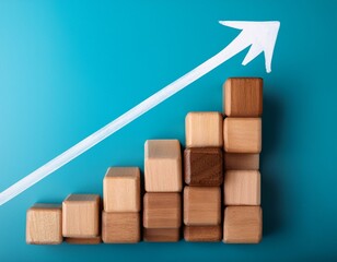 wooden blocks stacked to form stairs with an arrow pointing upwards
