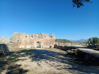 Scenic view of the ancient city of Perge in Antalya, featuring Roman columns and archaeological remains