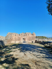 Scenic view of the ancient city of Perge in Antalya, featuring Roman columns and archaeological remains