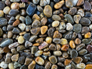 Close-up of smooth, colorful river rocks, perfect for backgrounds and textures