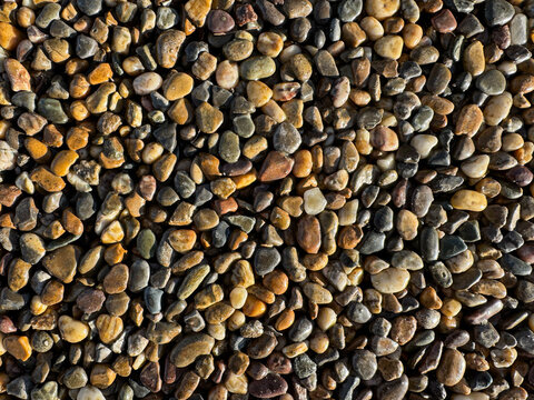 Close-up of colorful river rocks, perfect for backgrounds and textures