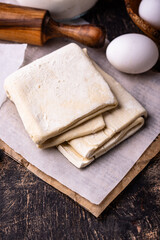 Raw puff pastry dough with baking ingredient