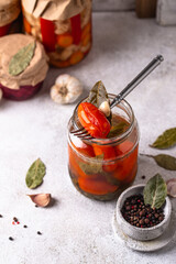 Marinated pickled tomatoes in jar