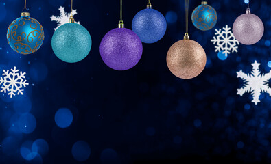 Christmas balls and snowflakes against dark background with bokeh lights. Colorful festive ornaments