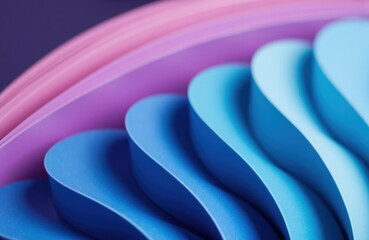 Colorful paper folds form soft waves of blue and purple hues in motion