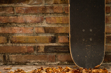 skateboard on a brick wall © Jimmy