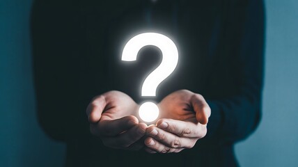 Person holding a glowing white question mark symbol in their cupped hands against a dark background, symbolizing doubt, inquiry, or problem solving