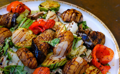 grilled vegetables eggplant, pepper, onion, tomato and beans on black background. High quality 