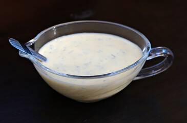 Flat lay composition with garlic sauce on grey background. Space for text. High quality photo