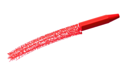 A red waxy writing tool, showing a stroke. The writing instrument lies diagonally across a black background, with the marked streak