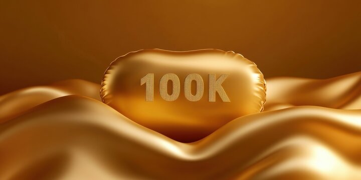 Gold metallic 100k balloon floats on flowing shimmering surface creating luxurious festive scene for celebrating milestone achievement