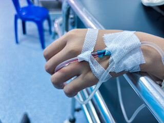 Urgent care patient receiving IV drip in hospital recovering from illness or injury recovery