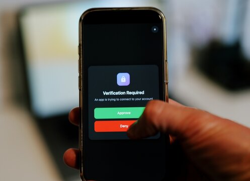 Man Uses Two Factor Authentication to Authorize Application Access Basic Enterprise Information Securtity Concept - 2FA MFA Mobile App