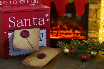 Santa's Mailbox. Festive mailbox with letters for Santa by a cozy fireplace, surrounded by holiday decor.
